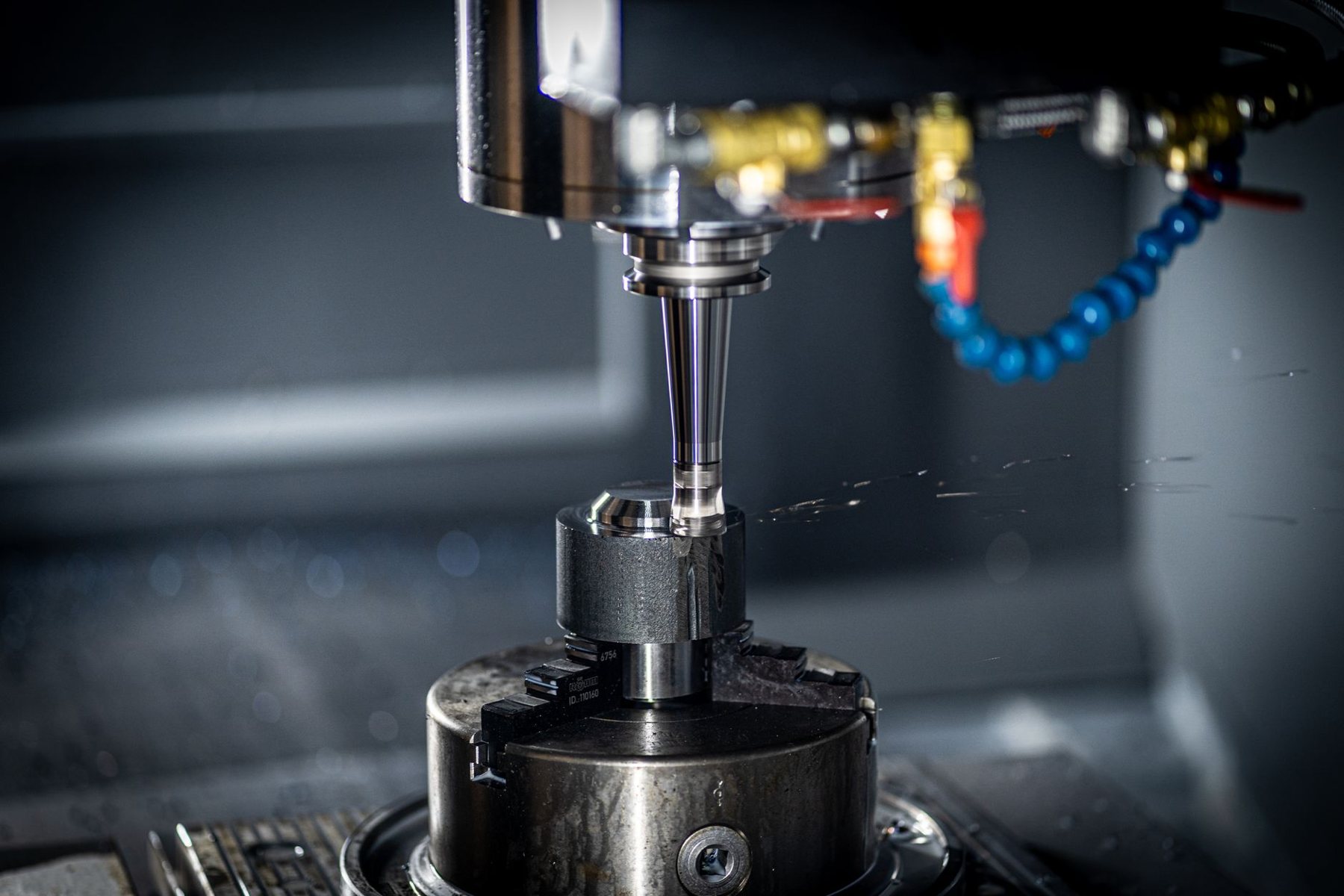 Machined parts with oil residue before laser degreasing